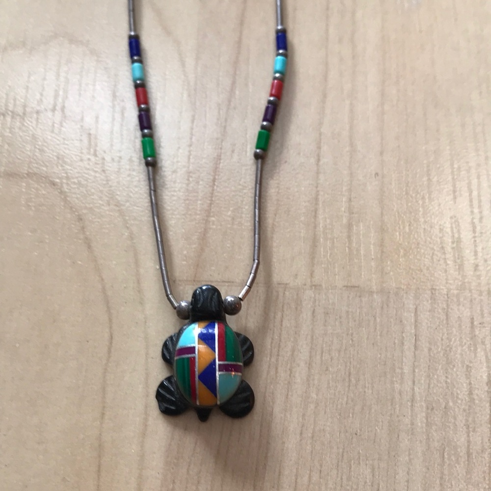 A beautiful turtle pendant ( with a chain).